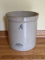 Front view showing Medalta stamp, 4 IMP and chip on rim