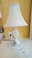 Full view of lamp with shade on countertop