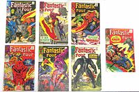 Front covers of all seven Fantastic Four comics laid out