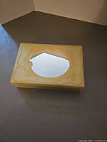 Top view showing oval mirror and ornate plastic scroll design