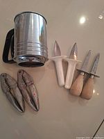 Group shot showing sifter, lobster crackers and oyster picks