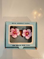 Front view of earrings in Royal Adderley box
