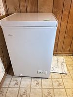 Front view of Danby white chest freezer with lid closed and control panel