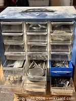 Front view of 18-drawer organizer filled with assorted hardware