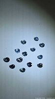 All 13 round blue sapphires arrayed on surface