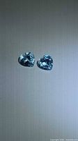 Pair of heart-cut blue topaz gemstones