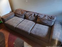 front angled view of entire sofa showing design and wear