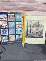 Both framed posters side by side showing images and scale