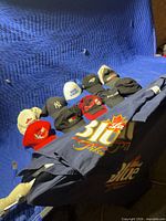 All hats arranged with folded Labatt umbrella