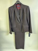 Full view of blazer and skirt on hanger showing color and style
