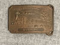 Front view showing locomotive relief, Wells Fargo and Company text, Wyoming panel