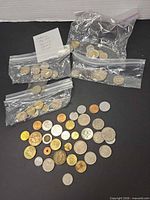Overview of four bags and loose coins