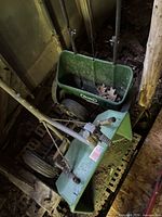 Two green Scotts push spreaders showing overall design and condition