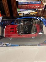 Boxed red 1967 Camaro SS 396 convertible 1:18 model in Maisto Special Edition packaging, front view