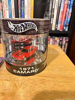 Hot Wheels red limited edition 1971 Camaro in cylindrical case