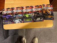Front view of five sealed Matchbox blister cards displayed on table