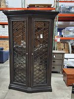 Front view closed showing glass doors with metal lattice