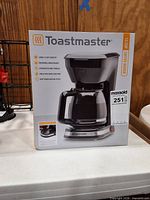 Front view of boxed Toastmaster coffee maker