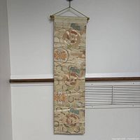 Full frontal view of the hanging silk obi showing overall pattern and length
