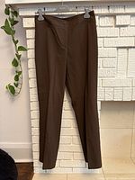 Front view brown dress pants hanging