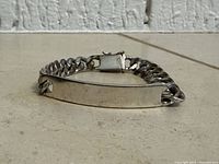 Overall view of sterling silver curb ID bracelet showing chain and ID plate