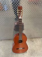 Full front view of Woneum Class 12 classical guitar