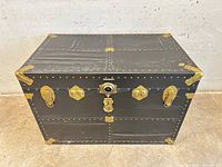 Front view closed showing brass hardware and black fibre exterior