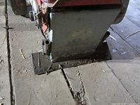 Front base of floor scraper showing scraper housing and mounting plate