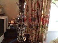 Full view of vintage crystal table lamp showing base, hanging prisms and lampshade