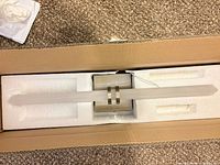 Light fixture in foam packaging, full length visible