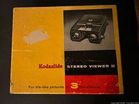 Front of worn yellow Kodaslide Stereo Viewer II box