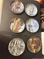 All six decorative plates laid out on table