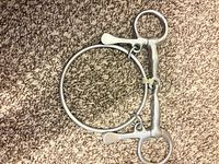 Jointed curb bit with attached large ring