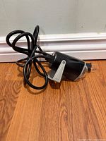 Full view of projection light with cord bundled