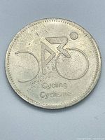 Obverse with cyclist design and bilingual text