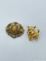 Front view of both brooches