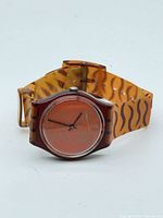 Front view of Swatch Skin Print wristwatch showing dial, case, and strap design