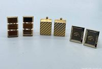 All three pairs of cufflinks front view