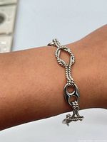 Bracelet on wrist showing link design and scale