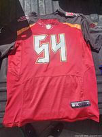 Front view showing number 54, team colors, Nike tailoring tag