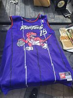 Front view showing team graphic, number 15, Nike size tag