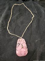 Full view of necklace showing pendant and chain