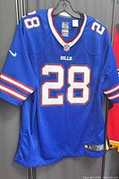 Front of blue Buffalo Bills #28 Nike jersey hanging