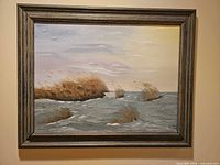 Frontal view of framed seascape painting showing entire artwork and frame