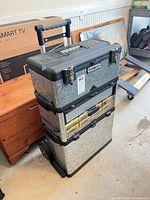 Front view of Stanley rolling tool chest showing stacked organizers and handle