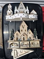 Overall view of wooden decor pieces resting on plastic tote