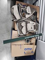 Overall lot: Simms vest, Ross rod tube, reel and spools