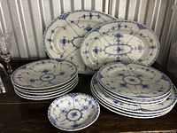 All thirteen Blue Fjord pieces grouped, showing pattern and variety