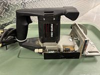 Left side view of Porter-Cable 556 plate joiner showing handle, motor housing and fence