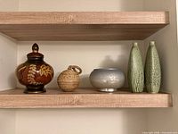 Shelf view showing all five decor items